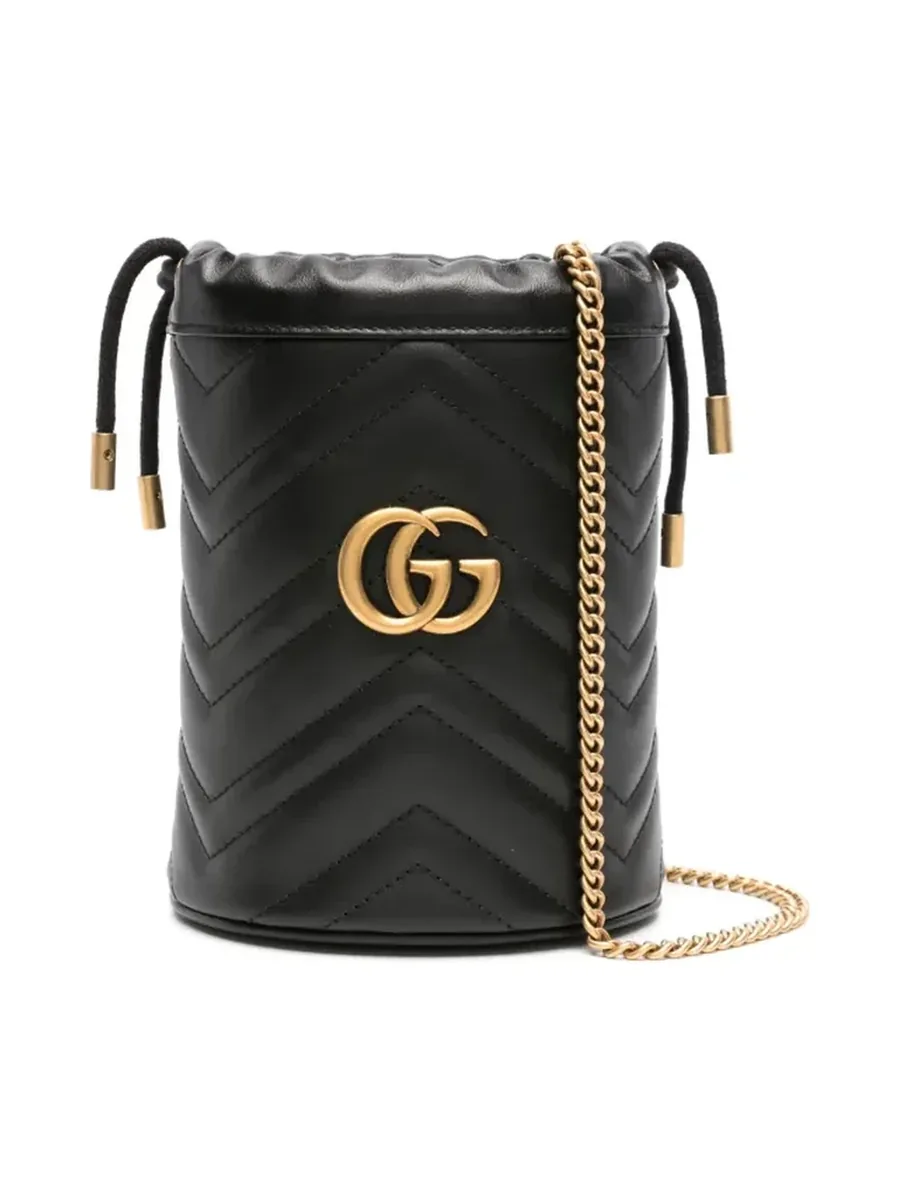 Mini black quilted leather bucket bag with a gold-tone Double G plaque and chain strap, front view