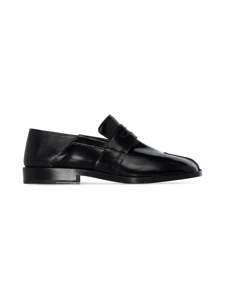 Black high-shine leather penny loafer with split toe, side view