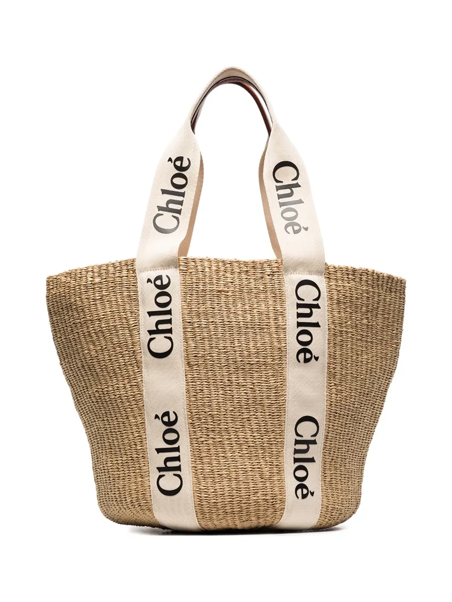 Woven beige basket tote with cream logo ribbon straps, front view