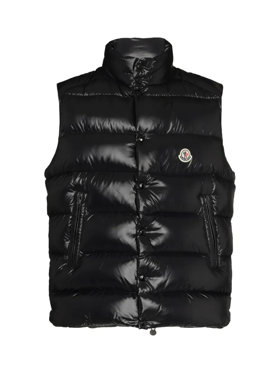 Black high-shine quilted down gilet with a high neck and logo patch at the chest, front view