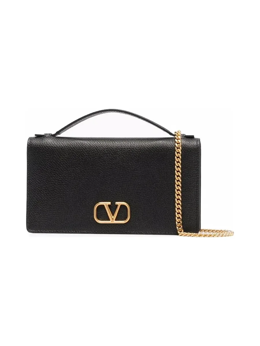 Black grained leather wallet on chain with a gold-tone VLogo and top handle, front view