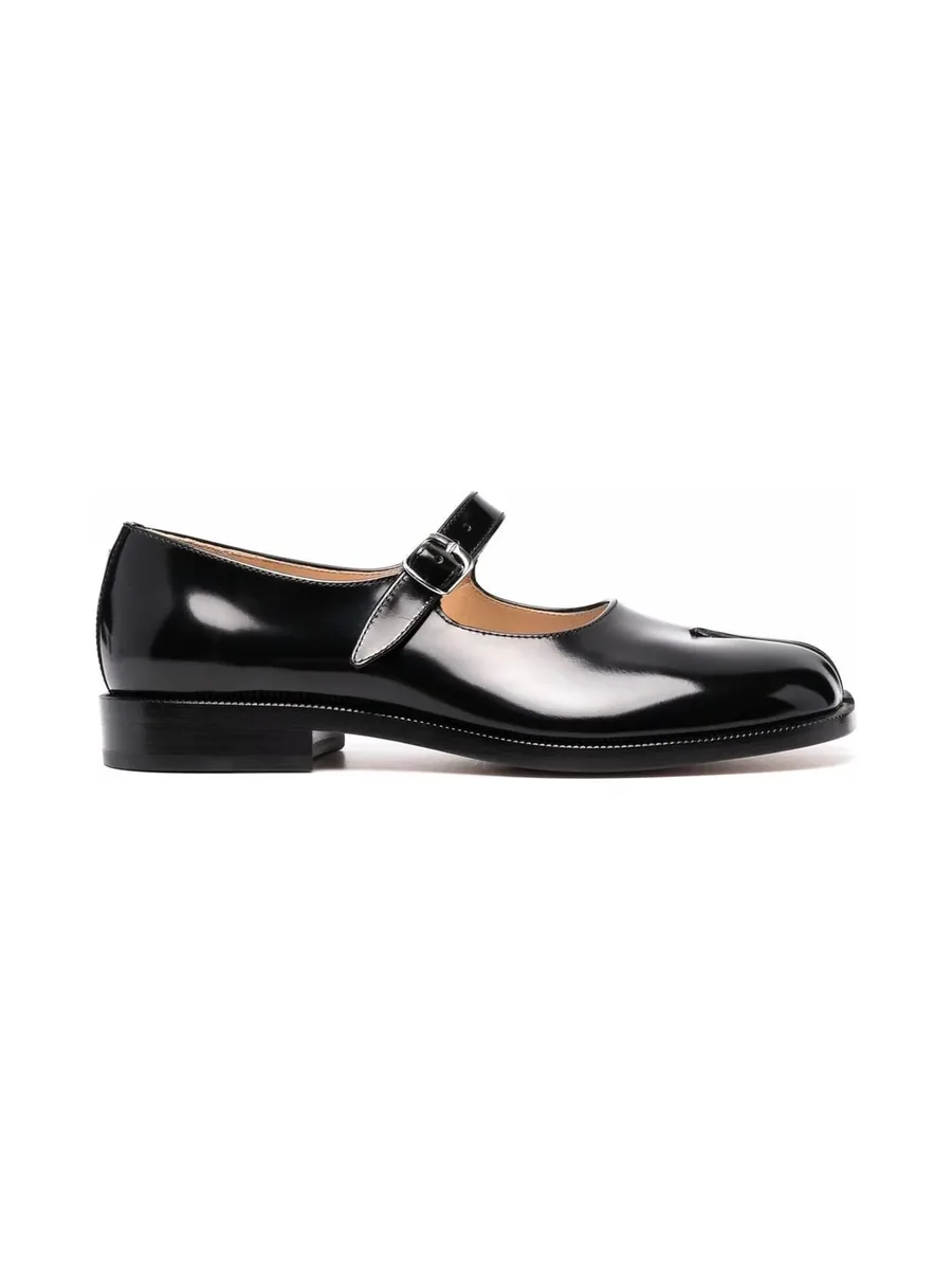 Black patent Mary Jane with split toe, buckle strap and low stacked heel, side view