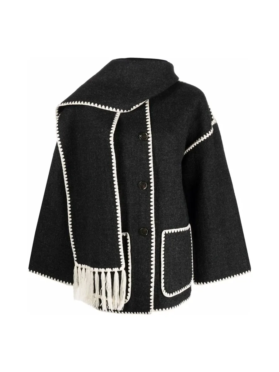 Dark grey wool jacket with cream embroidered edges and an attached fringed scarf, front view