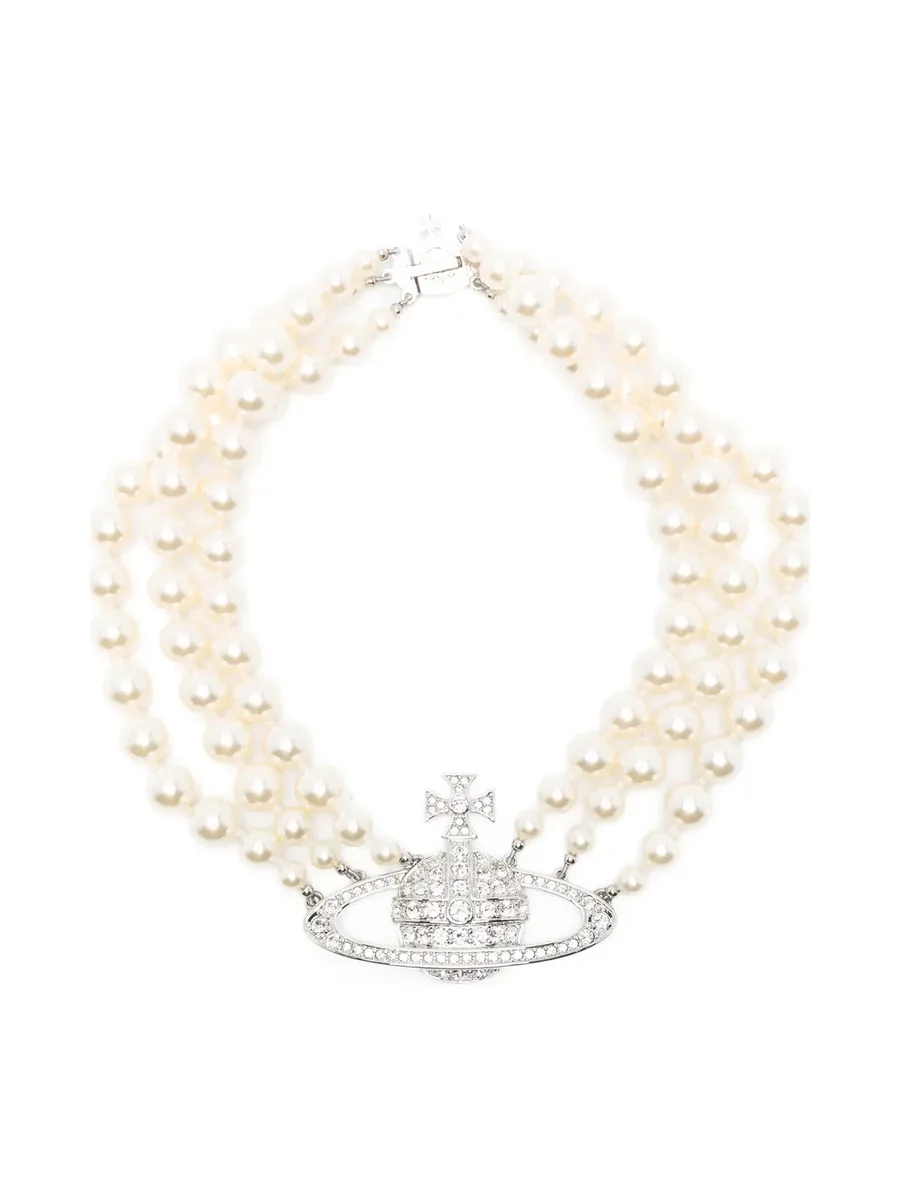 Three-row cream pearl necklace with a crystal Orb centrepiece, laid flat