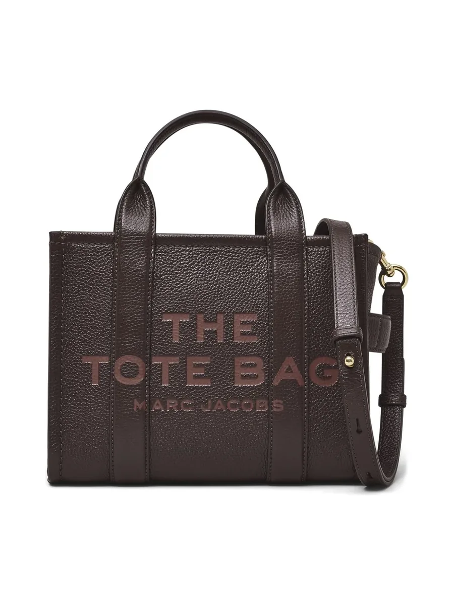 Small brown grained leather tote with debossed lettering, two handles and a strap, front view