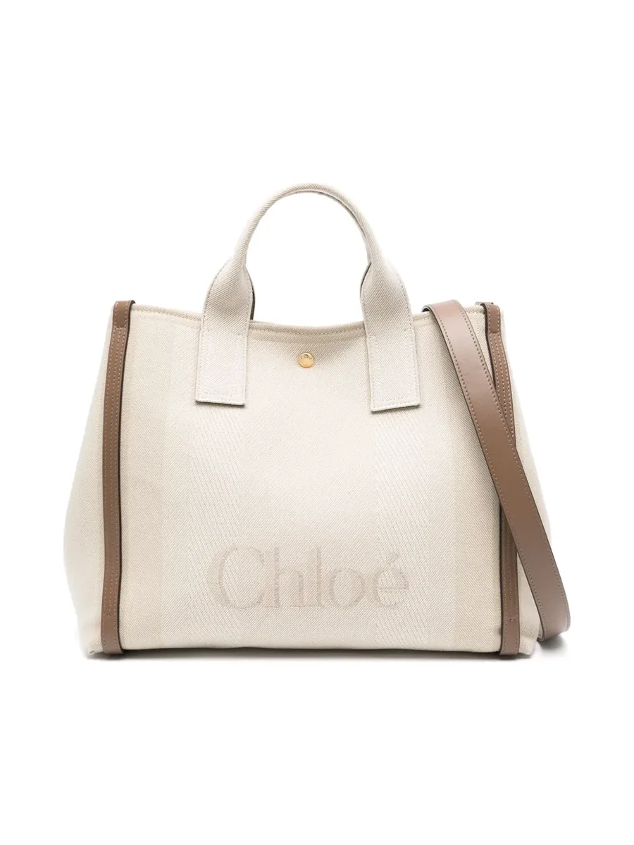 Ecru twill tote with taupe leather trim, two top handles, a shoulder strap and tonal logo, front view