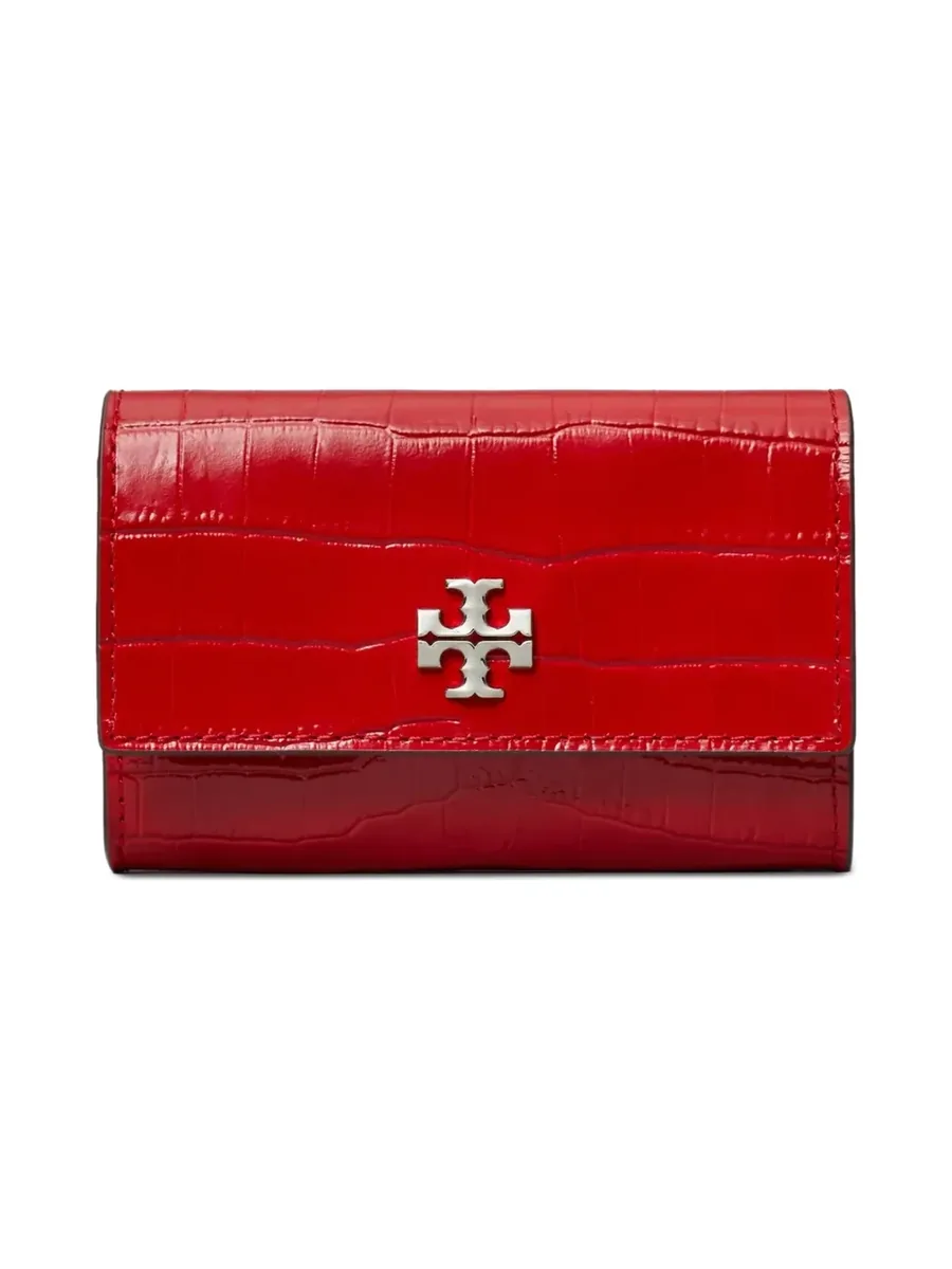 Red croc-embossed leather flap wallet with a silver-tone logo, front view