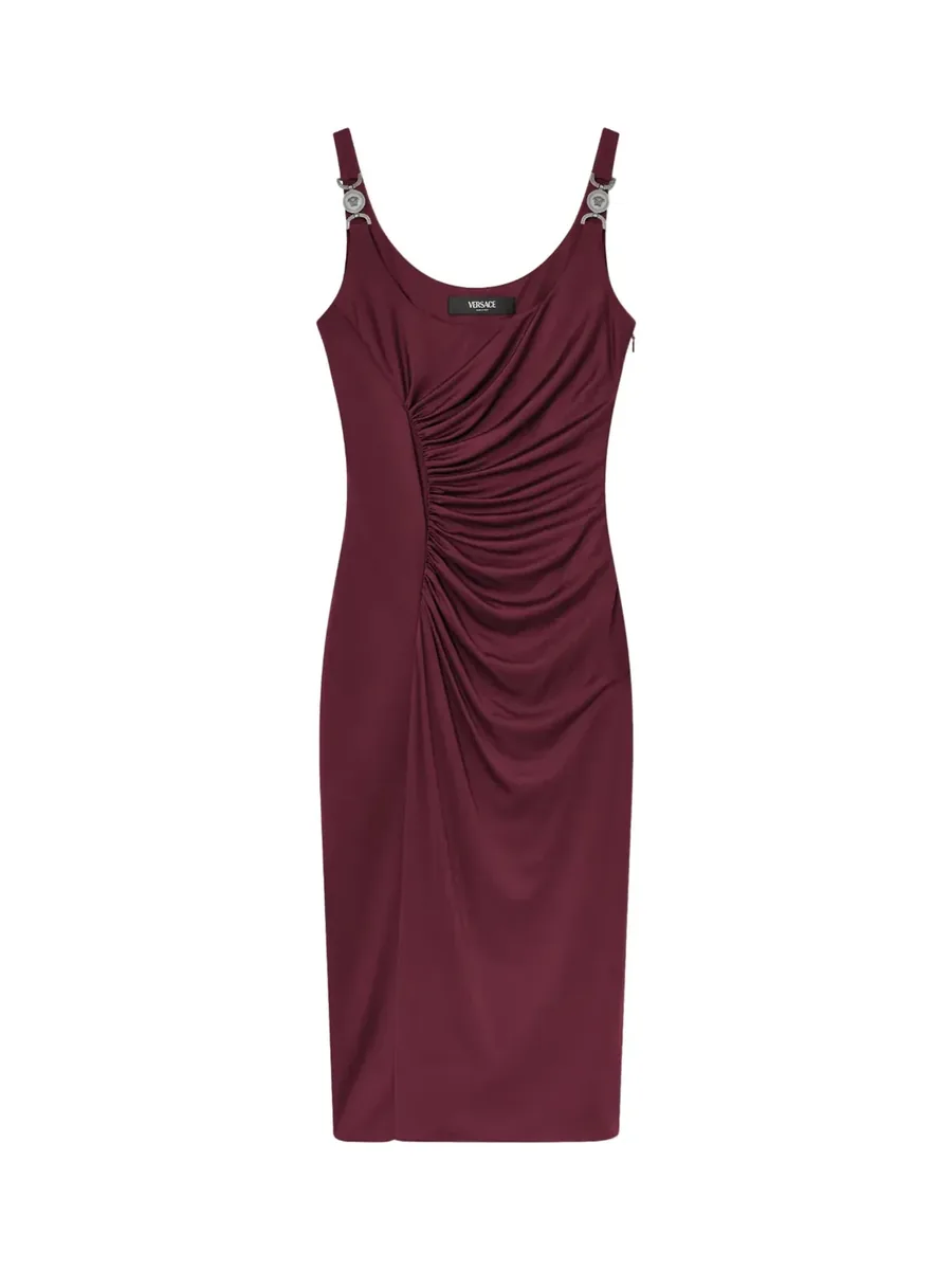 Dark red sleeveless midi dress with ruching at the side and metal hardware on the straps, front view