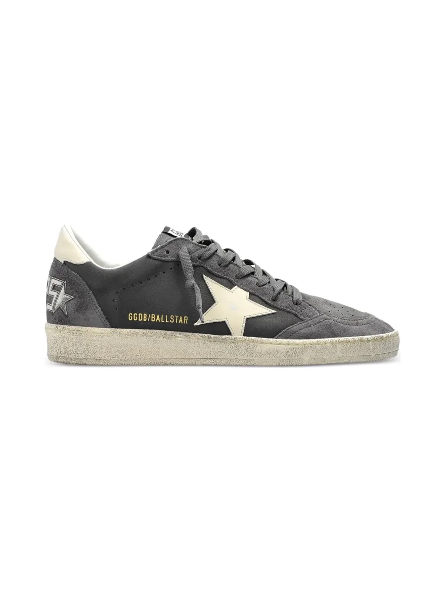 Grey leather and suede sneaker with a cream star at the side, side view