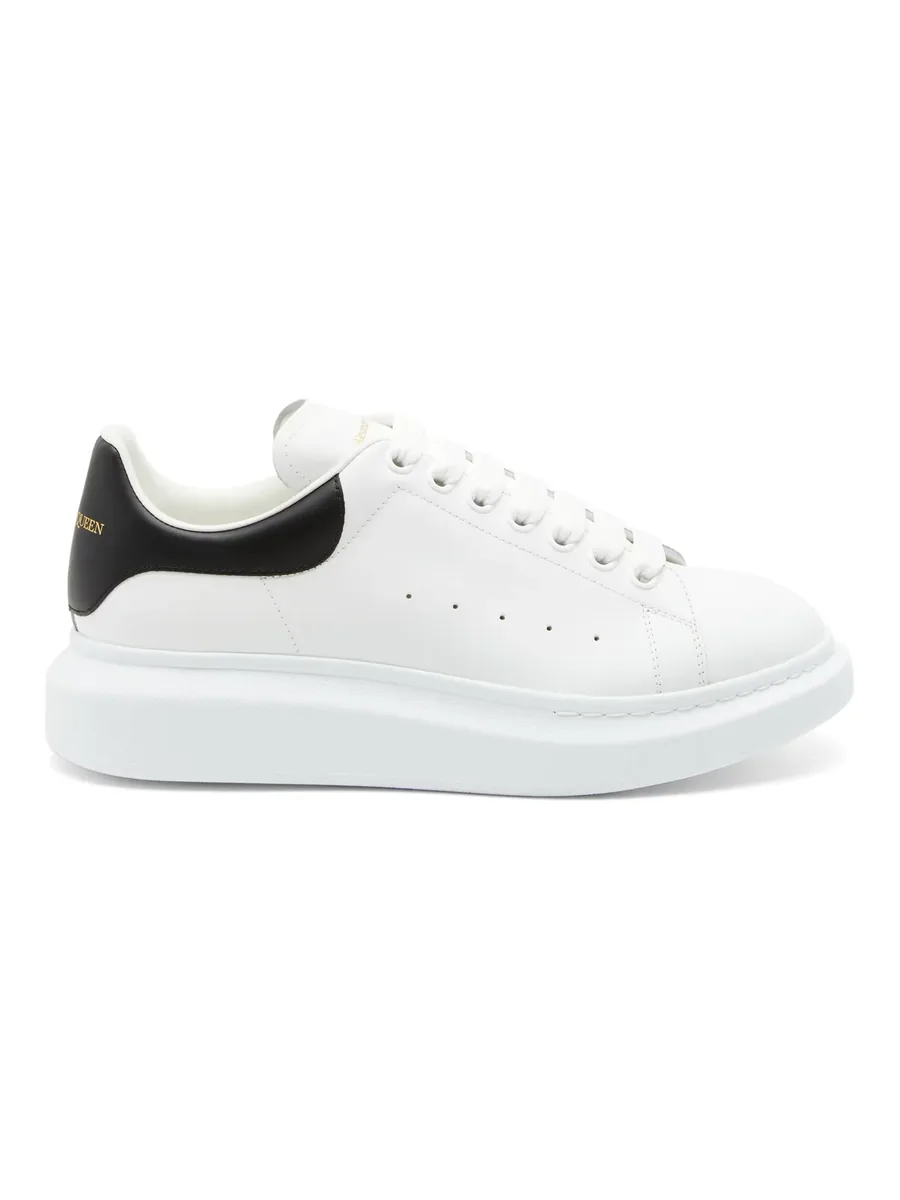 White Leather Oversized-Sole Sneaker with black heel, side view