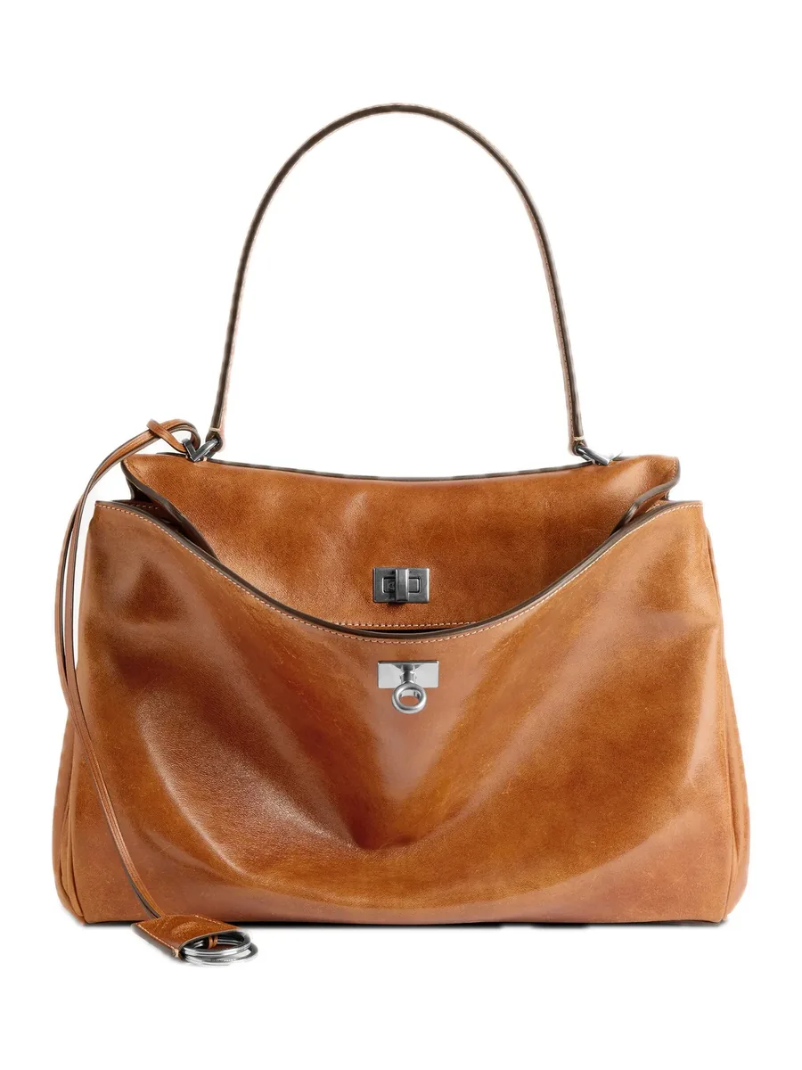 Tan Vegetable-Tanned Leather Top-Handle Bag with an open flap and a turn lock, front view
