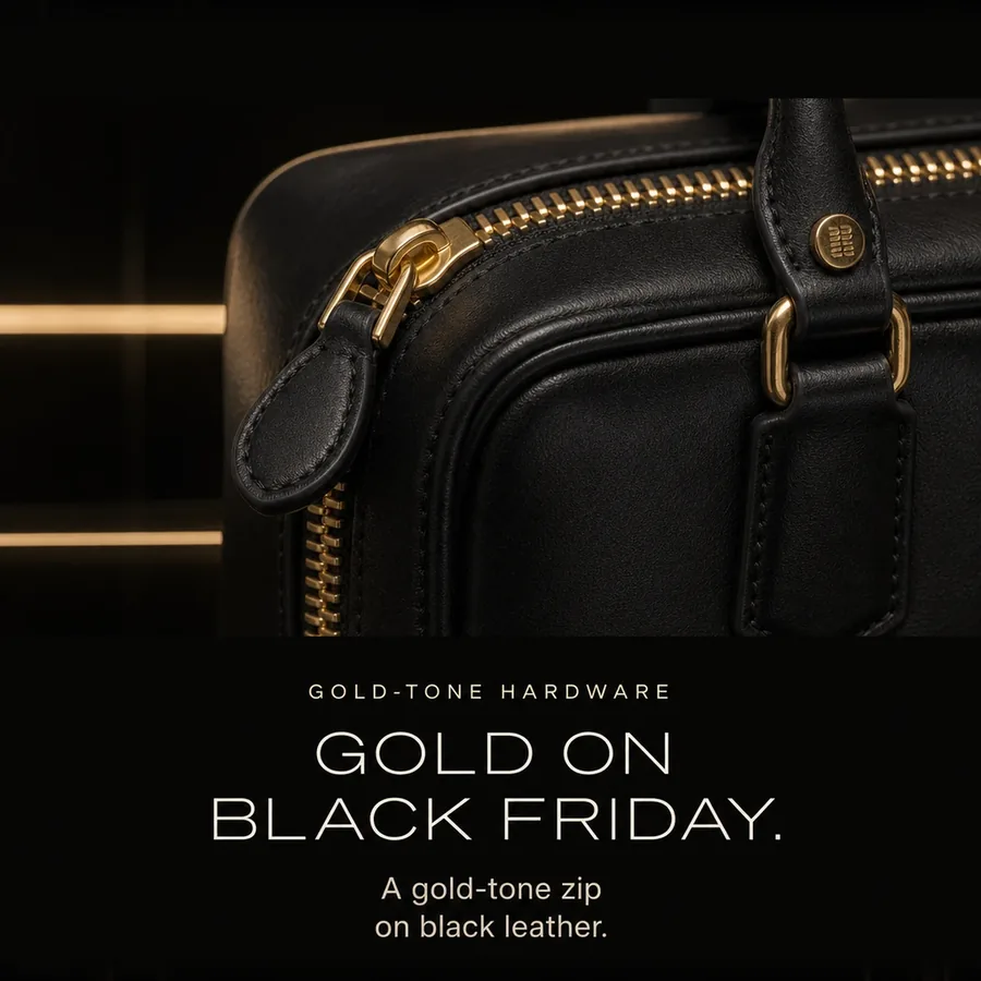 Gold on Black Friday: a gold-tone zip closure on black leather.